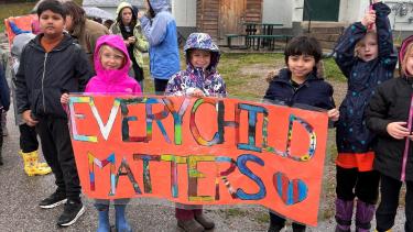 Every Child Matters sign by students 